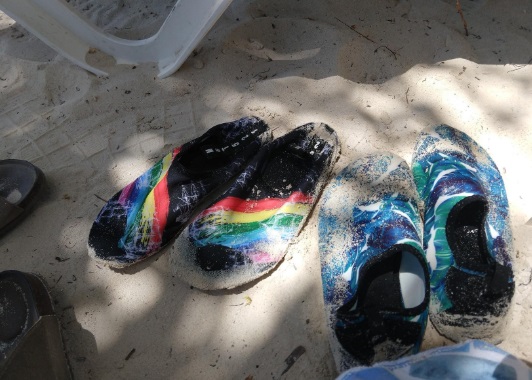 Best Water Shoes for Hawaii - two pair of lightweight water shoes in the sand