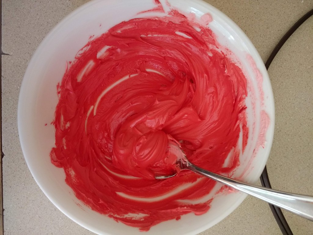 Icing colored with red gel for Lightning McQueen Cupcakes